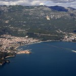 Budva: Aerial view of the town, beach and harbour with the island of St Nikola