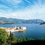Budva: The old town fills the headland. The island of St Nikola is behind