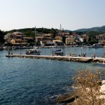 Kassiopi: The west breakwater with harbour and town behind