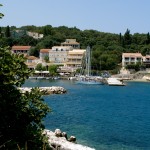 Kassiopi: The harbour entrance with yachts on the west quay