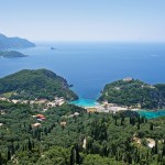 Paleokastritsa: The harbour, left and Spiridonos Bay, centre, on a quiet day
