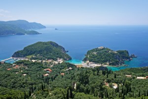 Paleokastritsa: The harbour, left and Spiridonos Bay, centre, on a quiet day