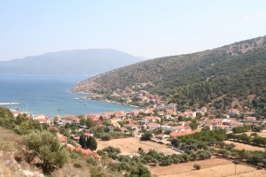 Efimia: The bay and town, with yachts at anchor and mast of those on the quay visible left