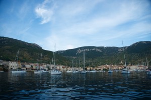 Komiza: Yachts anchored in front of the town, with St Nikola church on the hill, right
