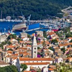 Mali Losinj: The marina by the gap in the island with the shipyard in front
