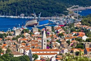 Mali Losinj: The marina by the gap in the island with the shipyard in front