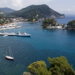 Parga, the east bay with Panayia Island and a yacht on the pier