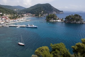 Parga, the east bay with Panayia Island and a yacht on the pier