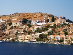 Symi Town: The north side of the harbour with local boats on the quay Symi Town: The north side of the harbour with local boats on the quay