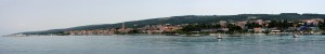 Supetar: Panorama of the town looking south east with the ferry port far left