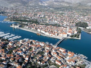 Trogir: Aerial view of the old town on the island Trogir: Aerial view of the old town on the island showing the marina and long quay opposite
