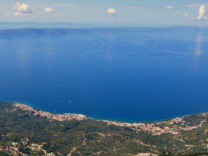 Tucepi: Aerial view of the town and harbour with Hvar Island in the distance