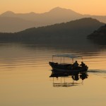 Gocek Bay: Fishermen at sunrise in traditional fishing boat
